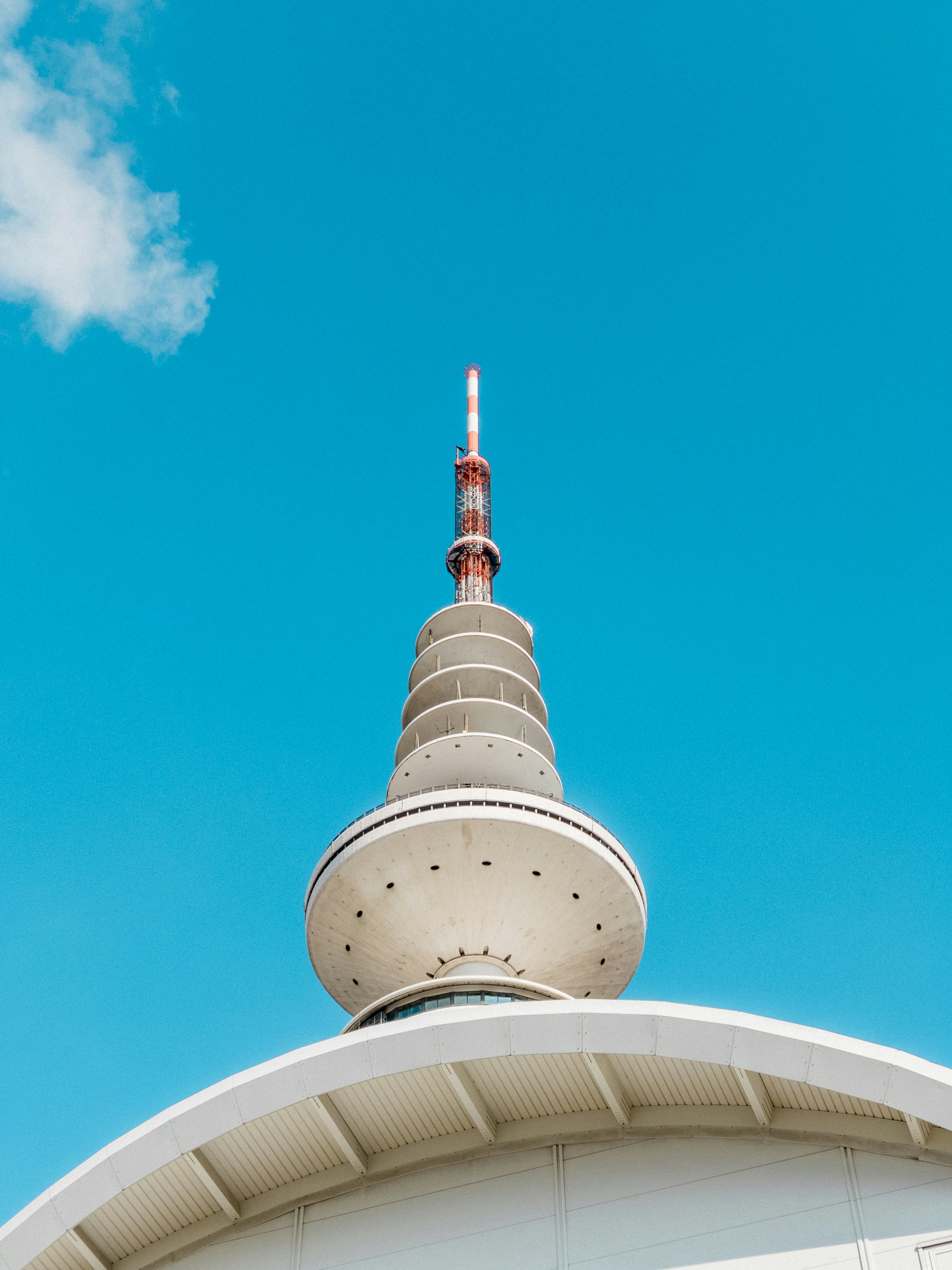 A tall communication tower rises into the sky.