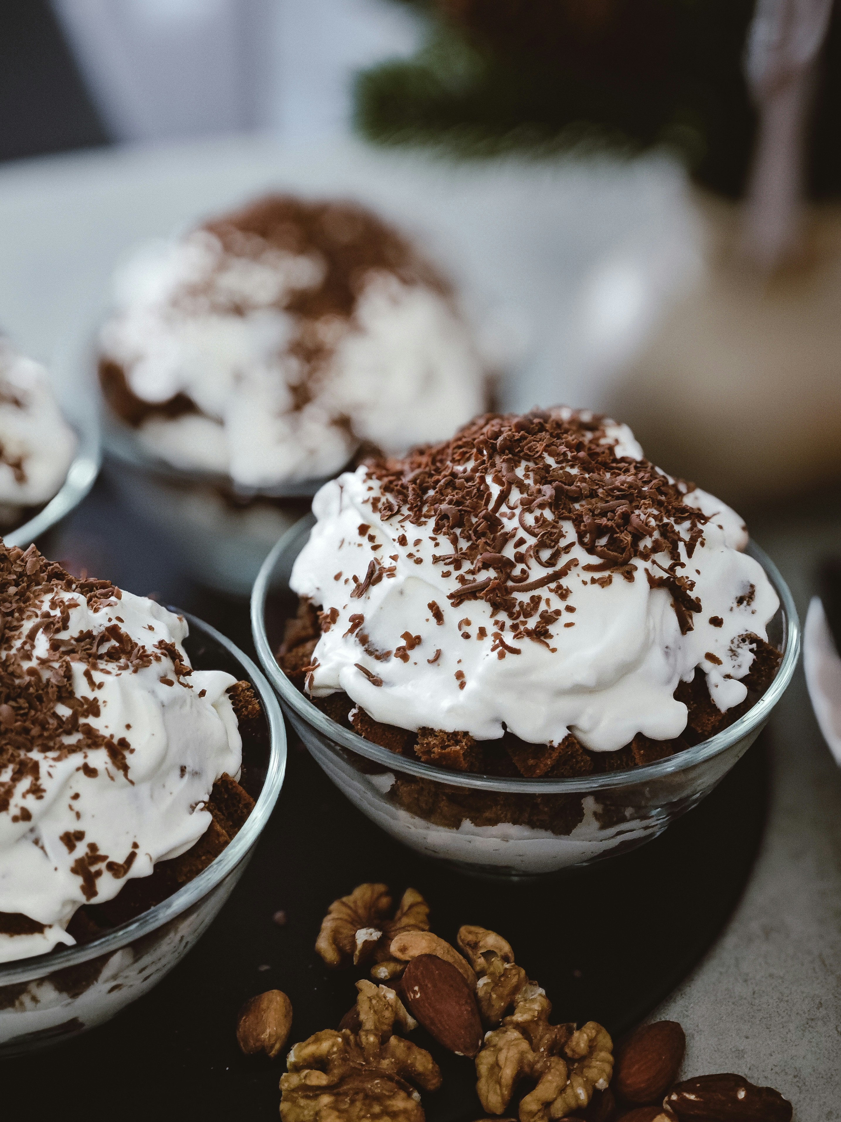 Delicious chocolate desserts topped with whipped cream.