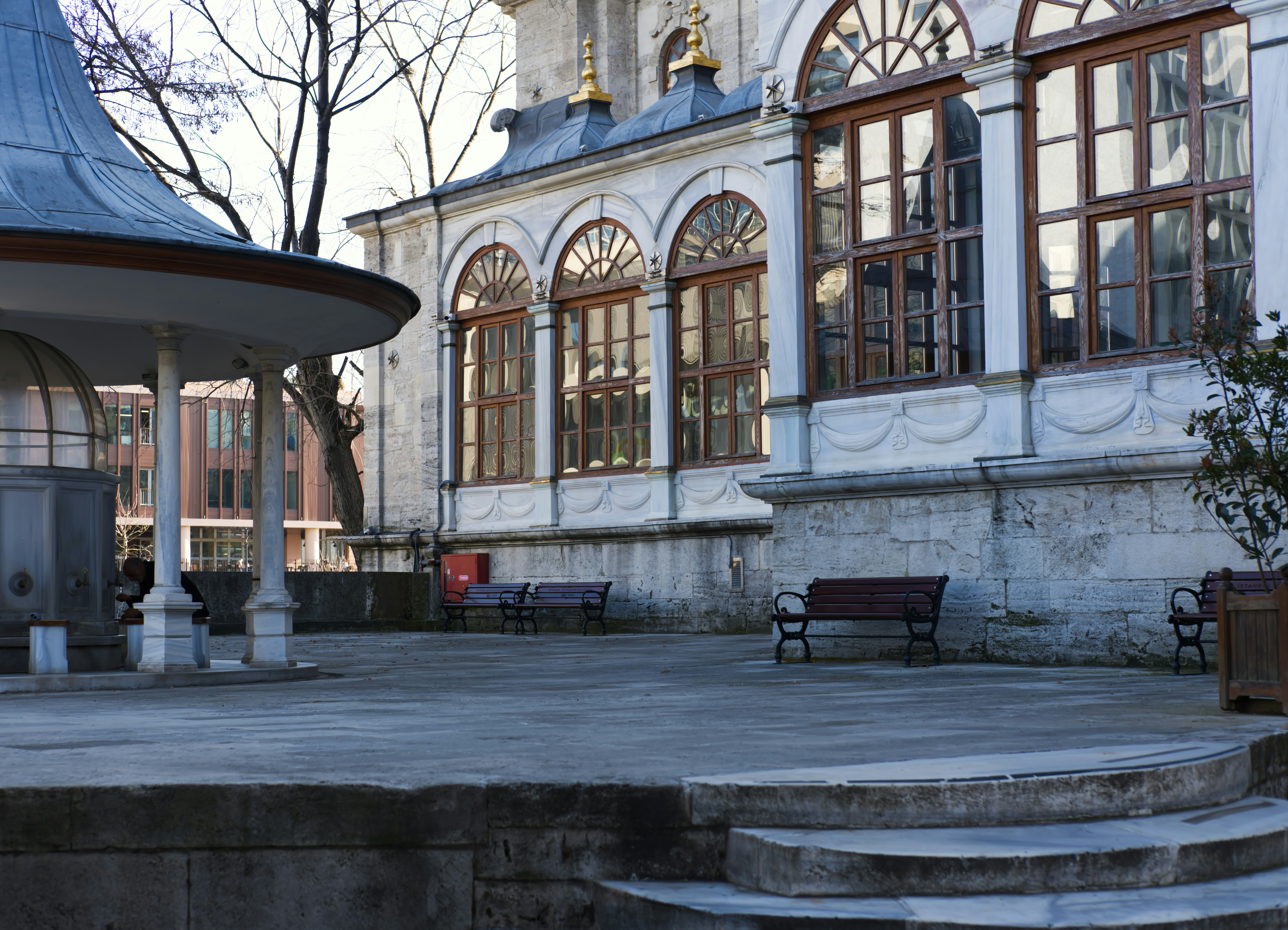 Historical building and courtyard captured during daytime.