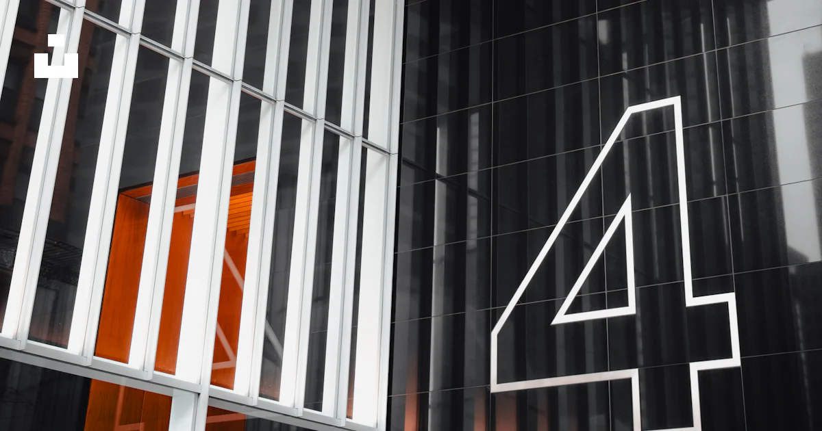 Modern building features a large, white number 4. photo – Free Building ...
