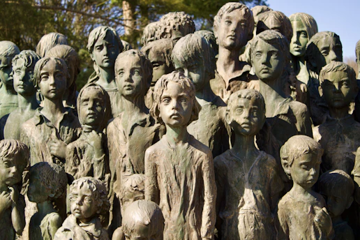 A memorial of bronze statues of children.