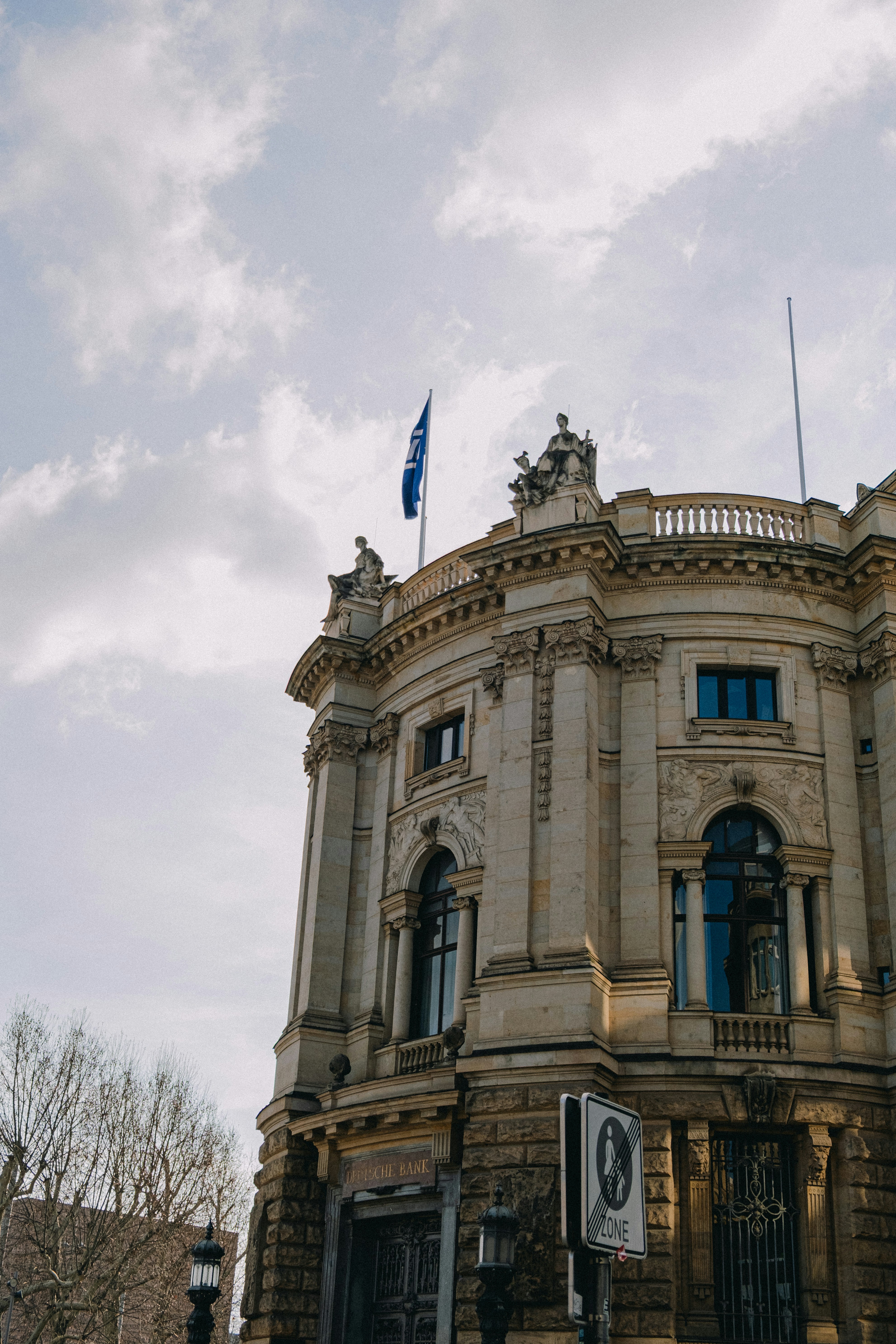 Ornate building stands tall against a cloudy sky.
