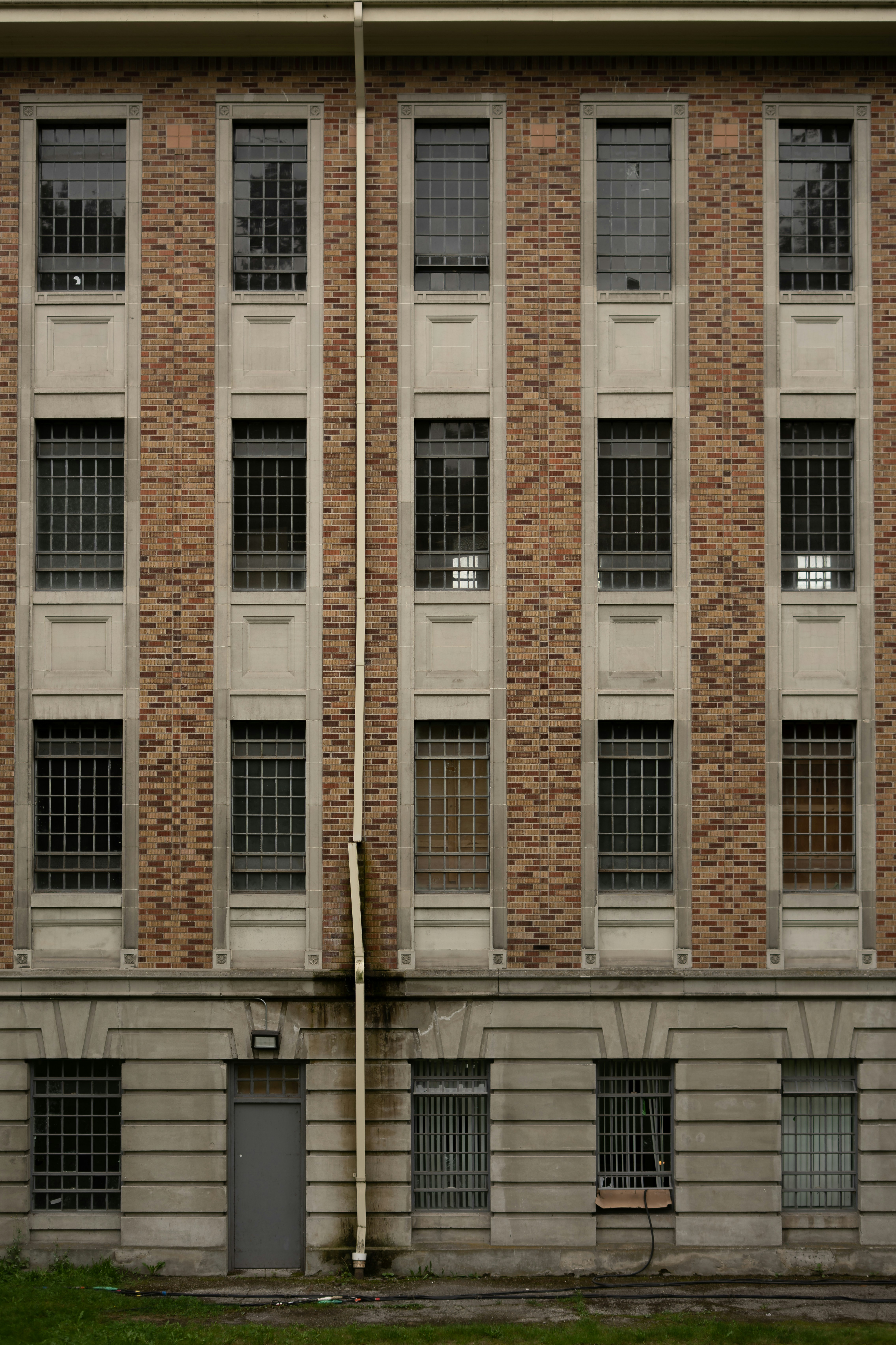 Brick building with barred windows.