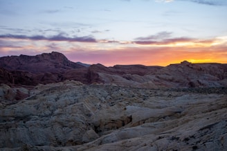 Sunset illuminates a rocky landscape.