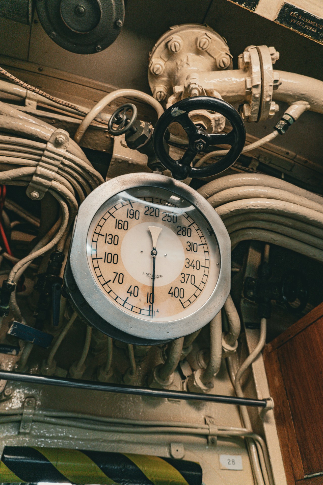 A vintage gauge and control panel are shown.