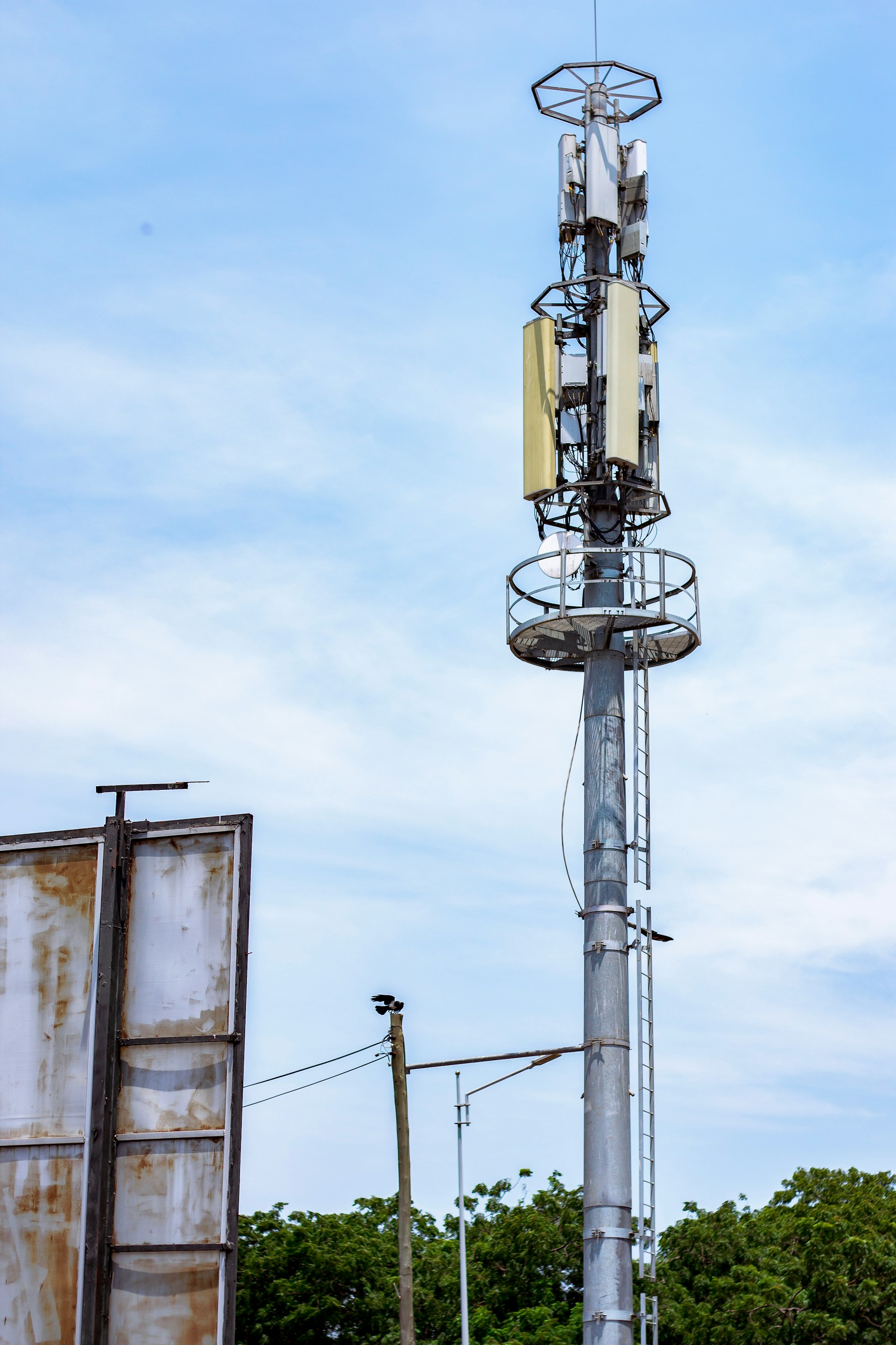 Cell tower against a blue sky.