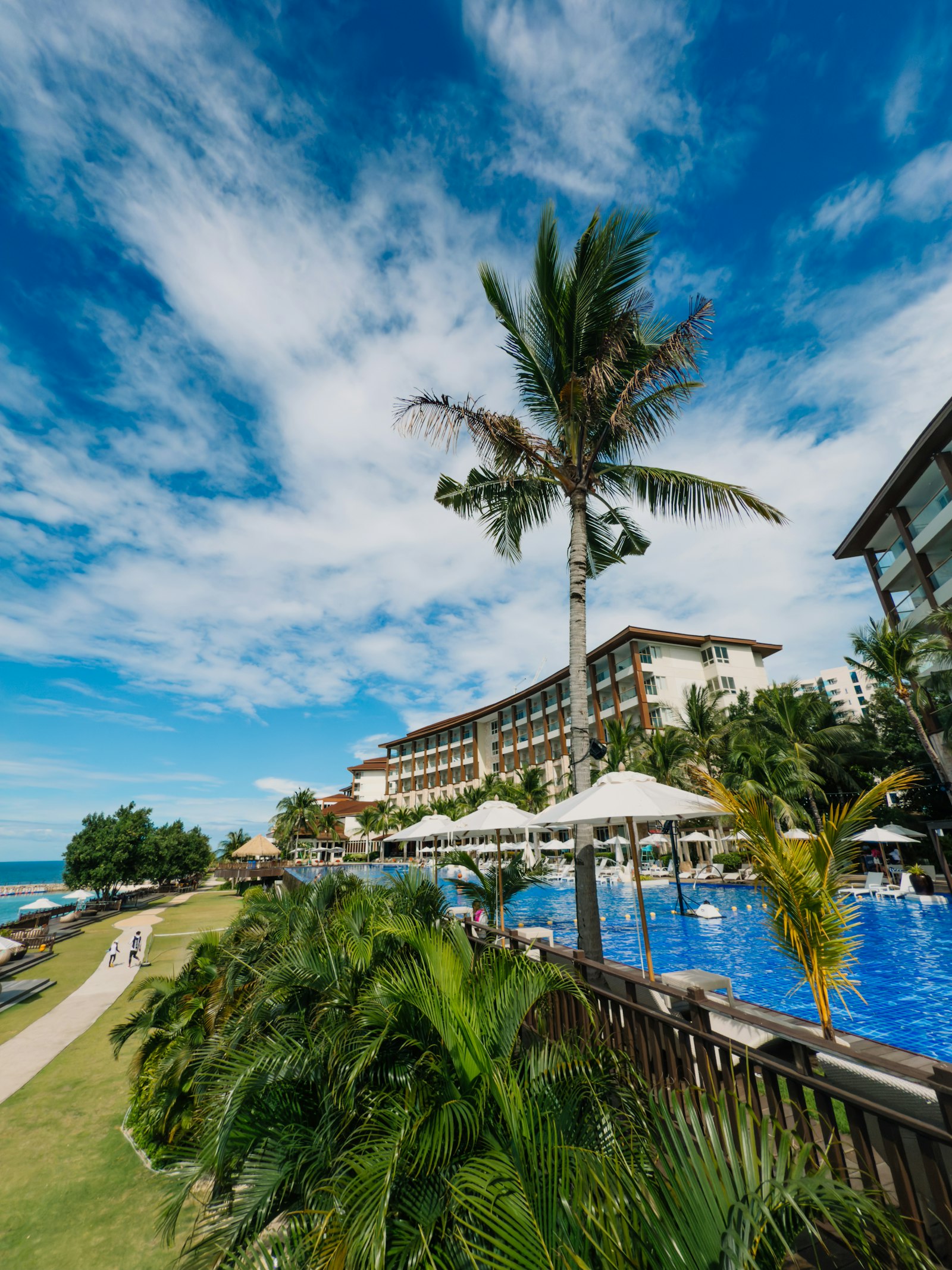 Hilton Fiji Beach Resort & Spa — luxury beachfront resort pool and palm trees on Denarau Island, Fiji