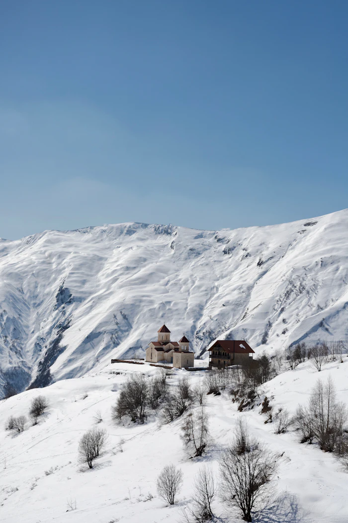 Church on a snowy mountain in Georgia