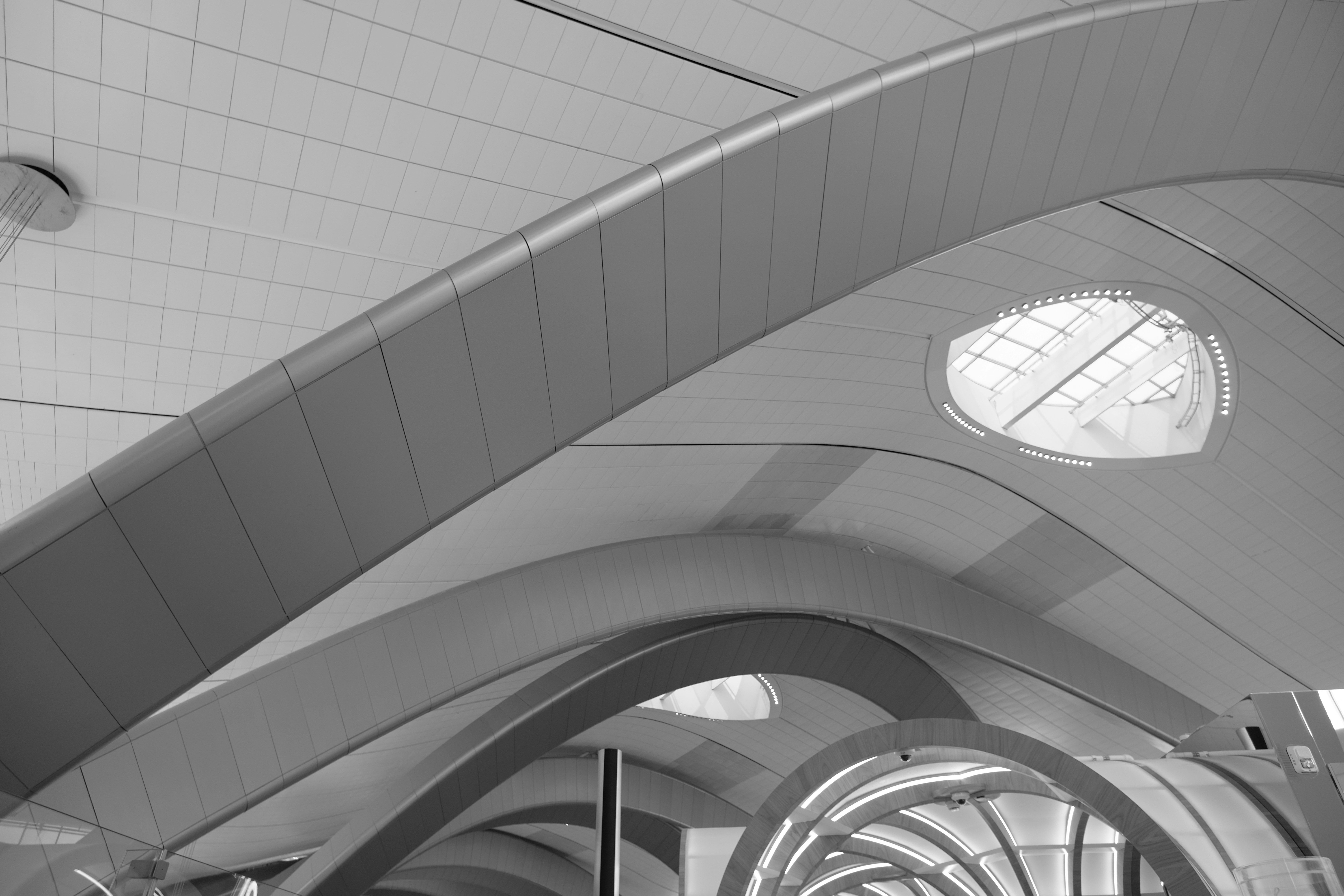 Airport ceiling's modern architecture is visible.
