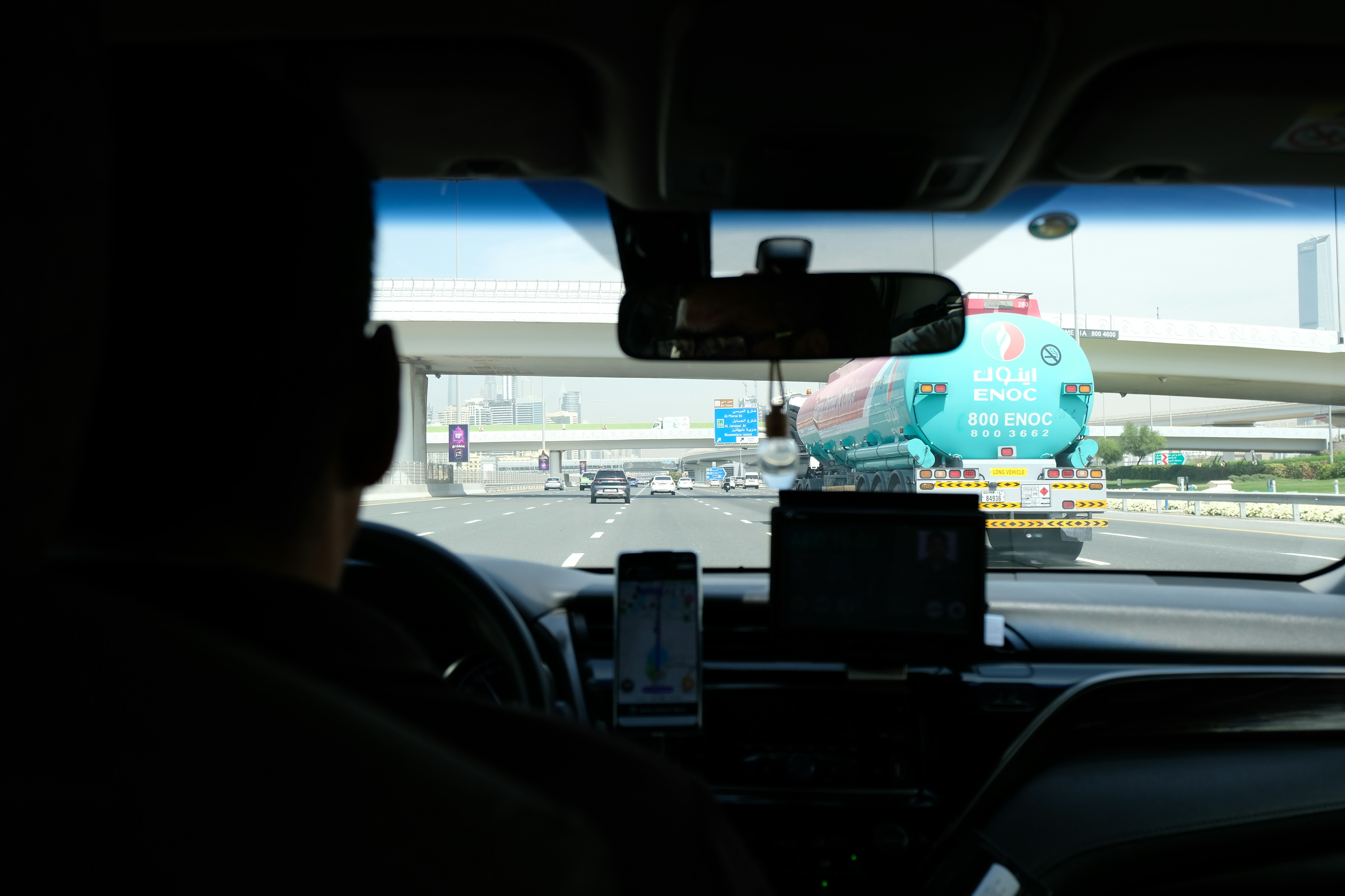 A person is driving a car on a highway.