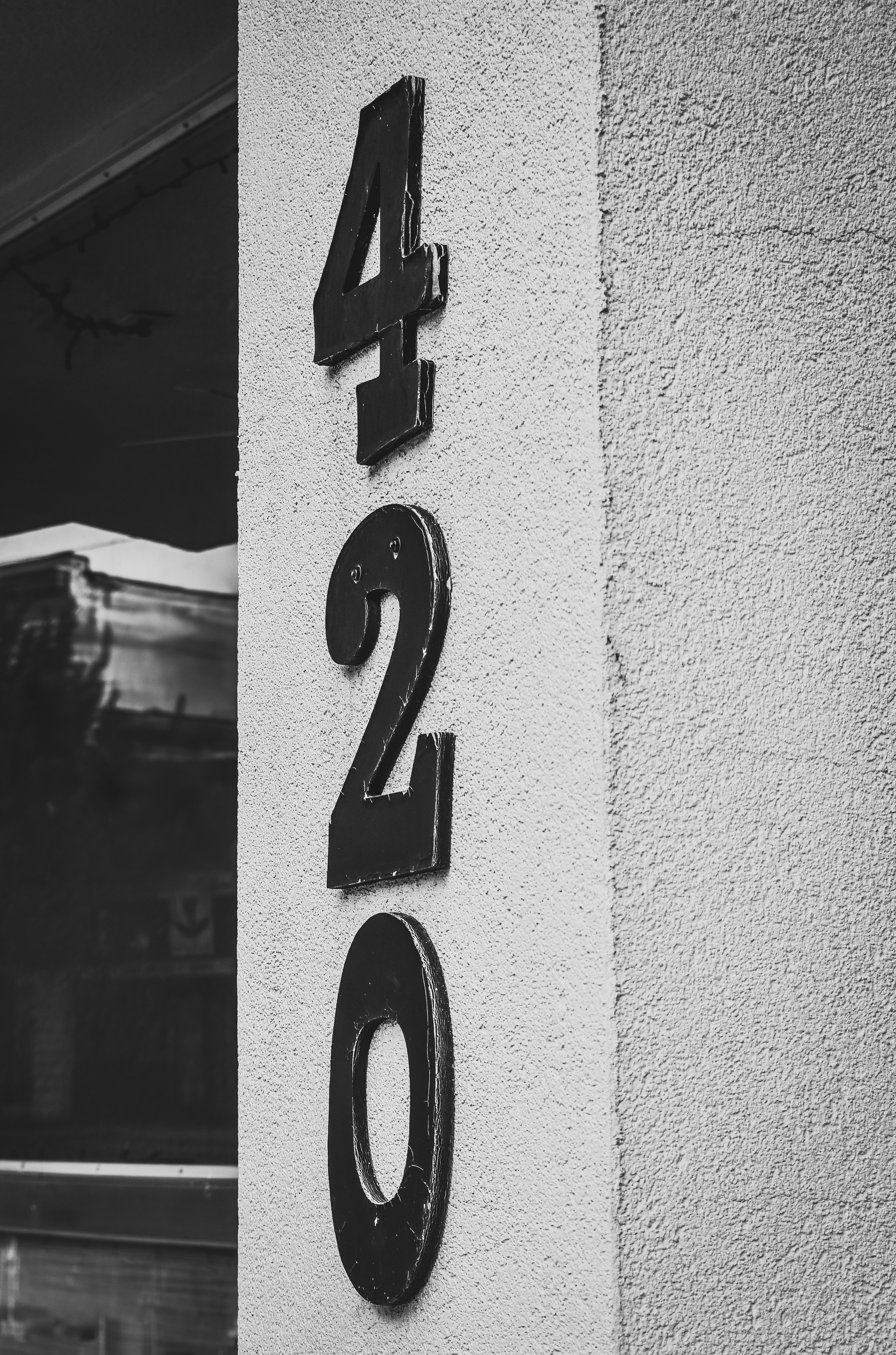 Street number "420" on a wall.