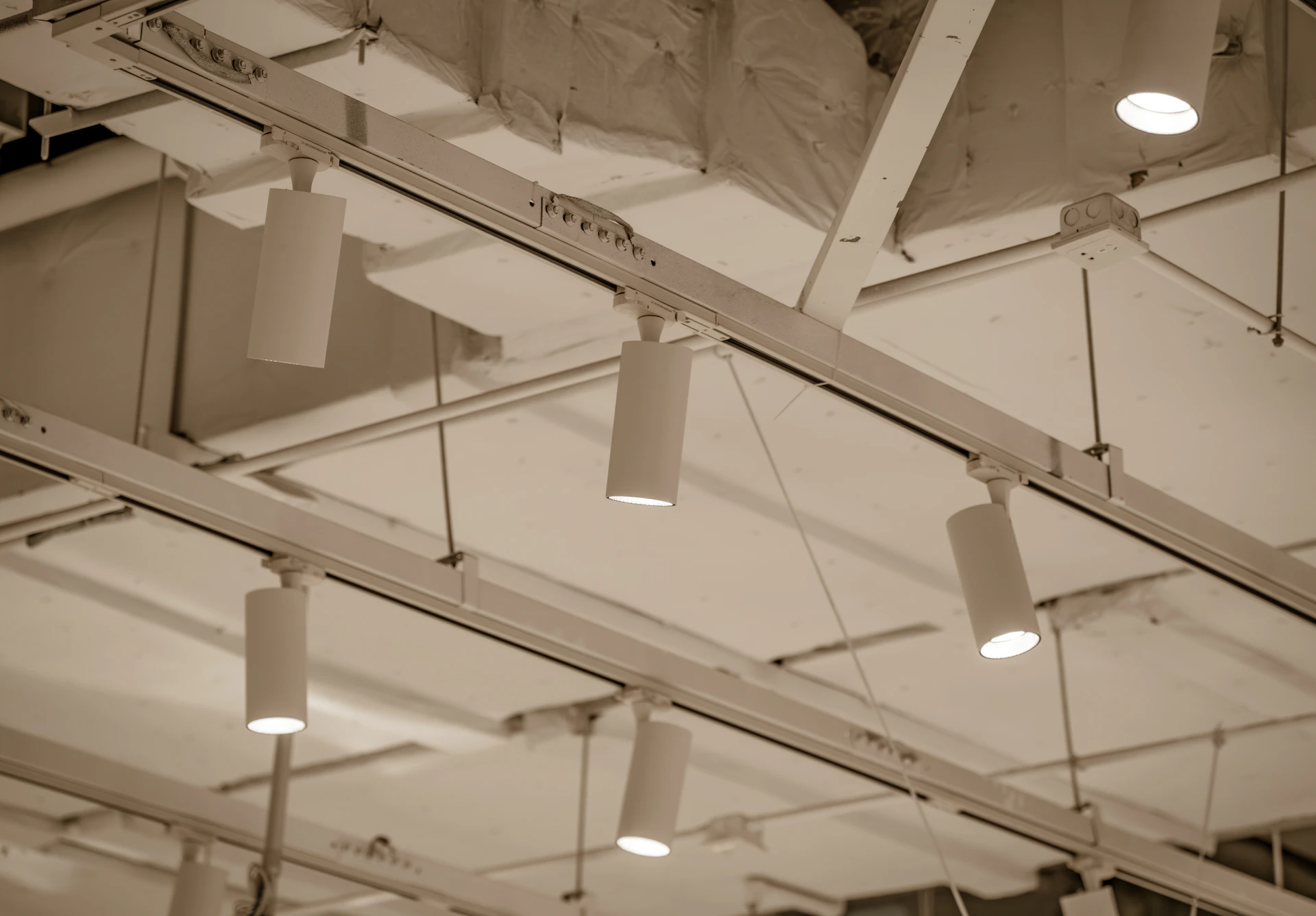 Track lighting fixtures are installed on the ceiling.