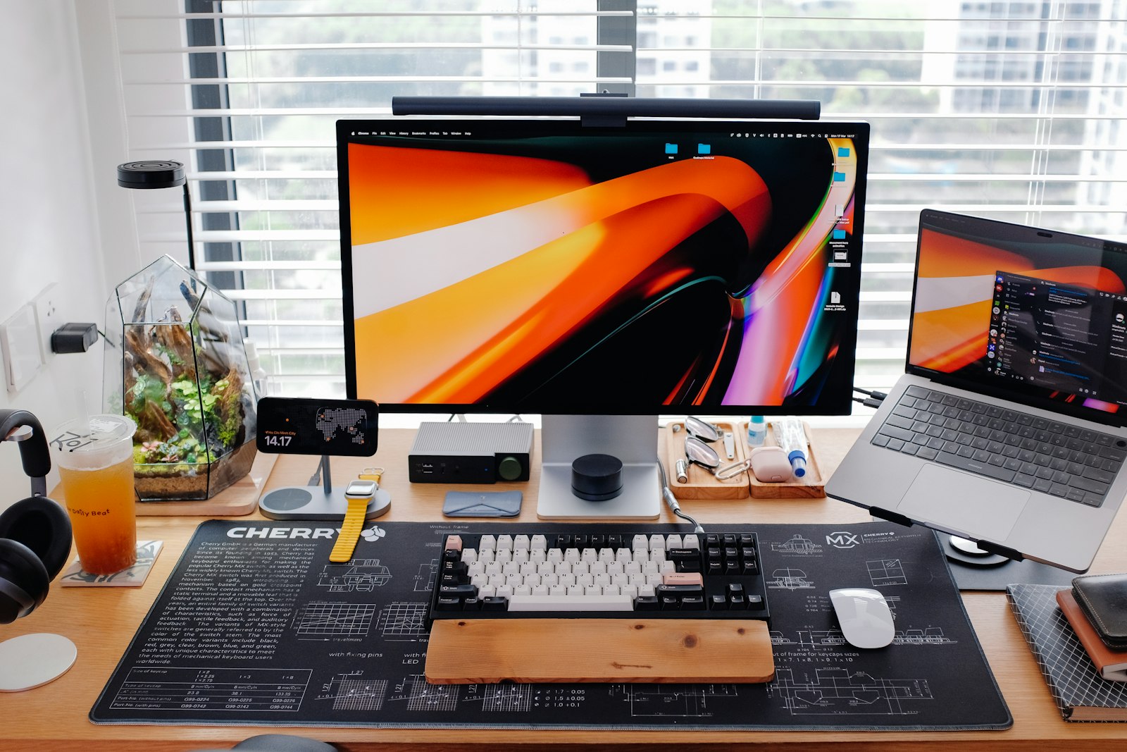 Sleek modern desk setup with multiple screens running design tools