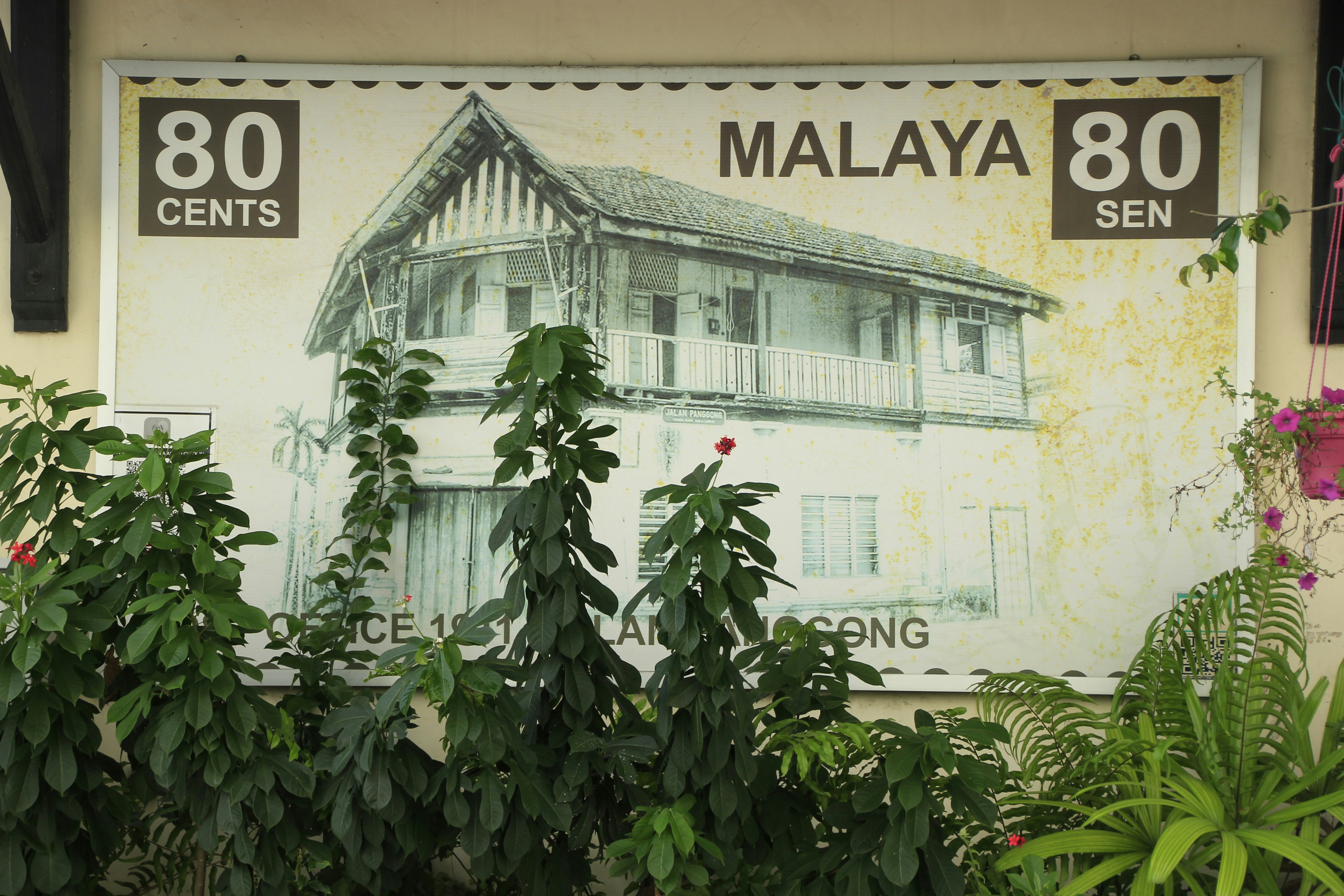 Wall paint of a stamp shown old building.