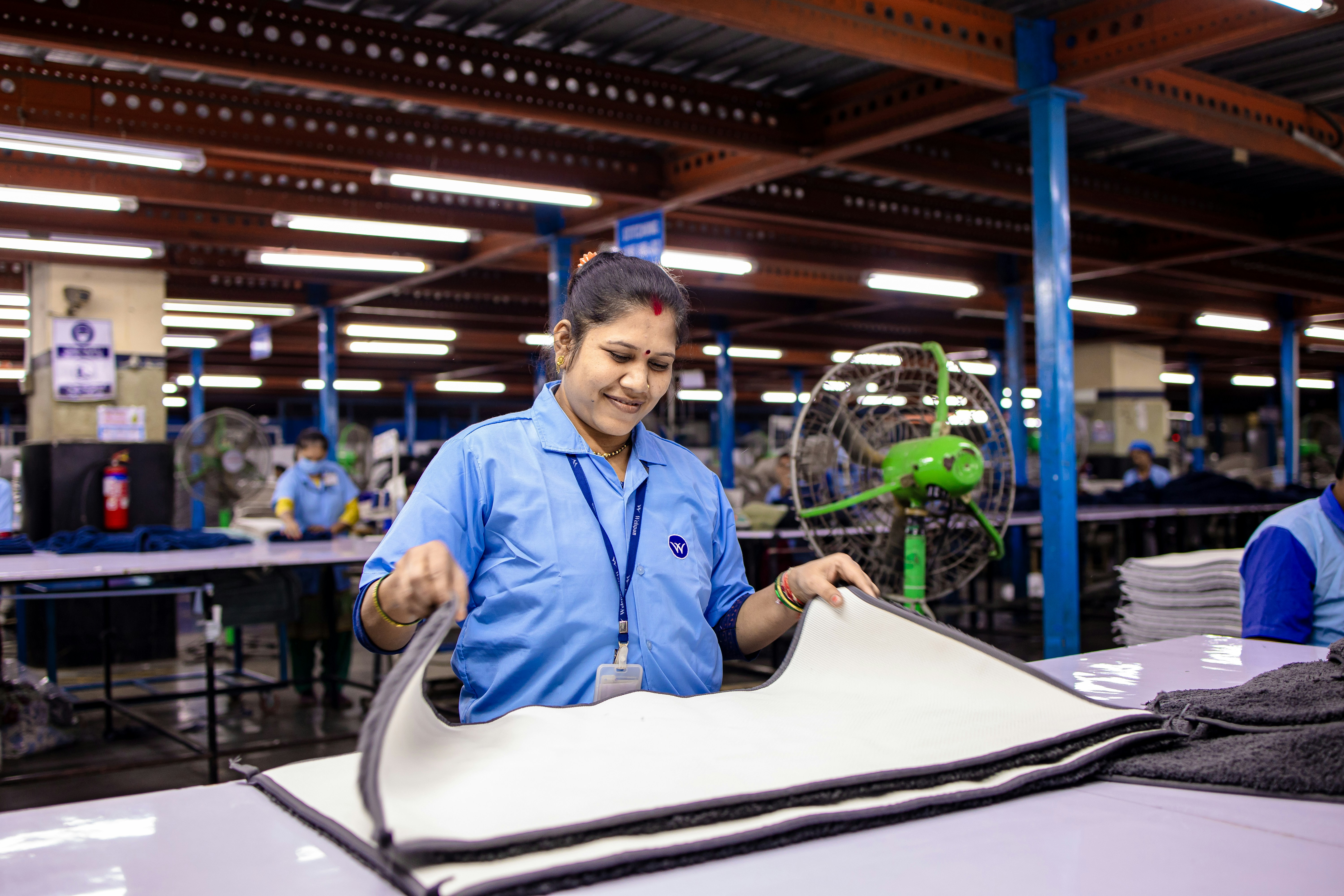 Woman working in a clothing manufacturing factory.