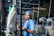 Woman works in a textile manufacturing facility.