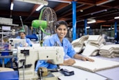 Women are sewing in a textile factory.