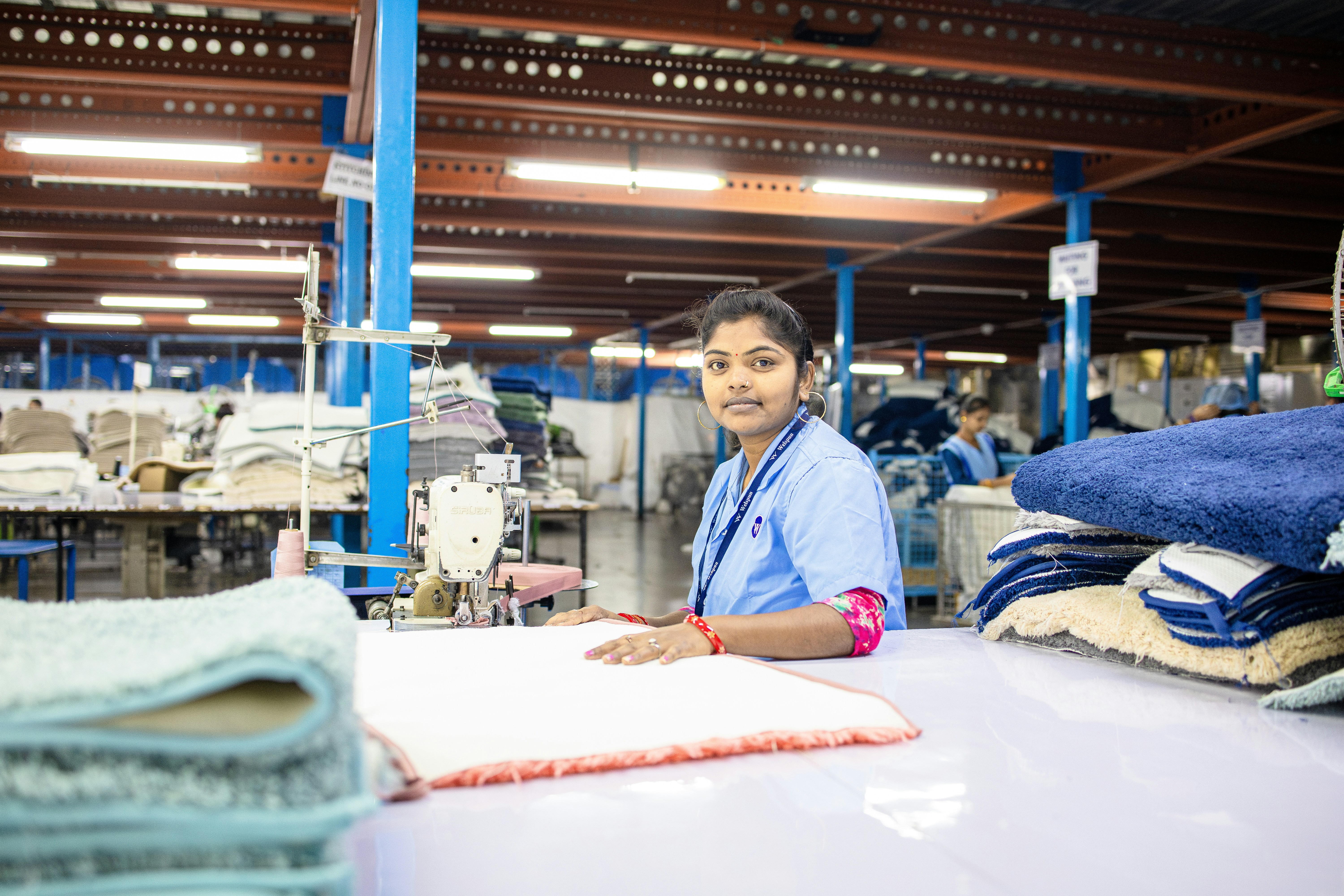 Woman is sewing in a textile factory.