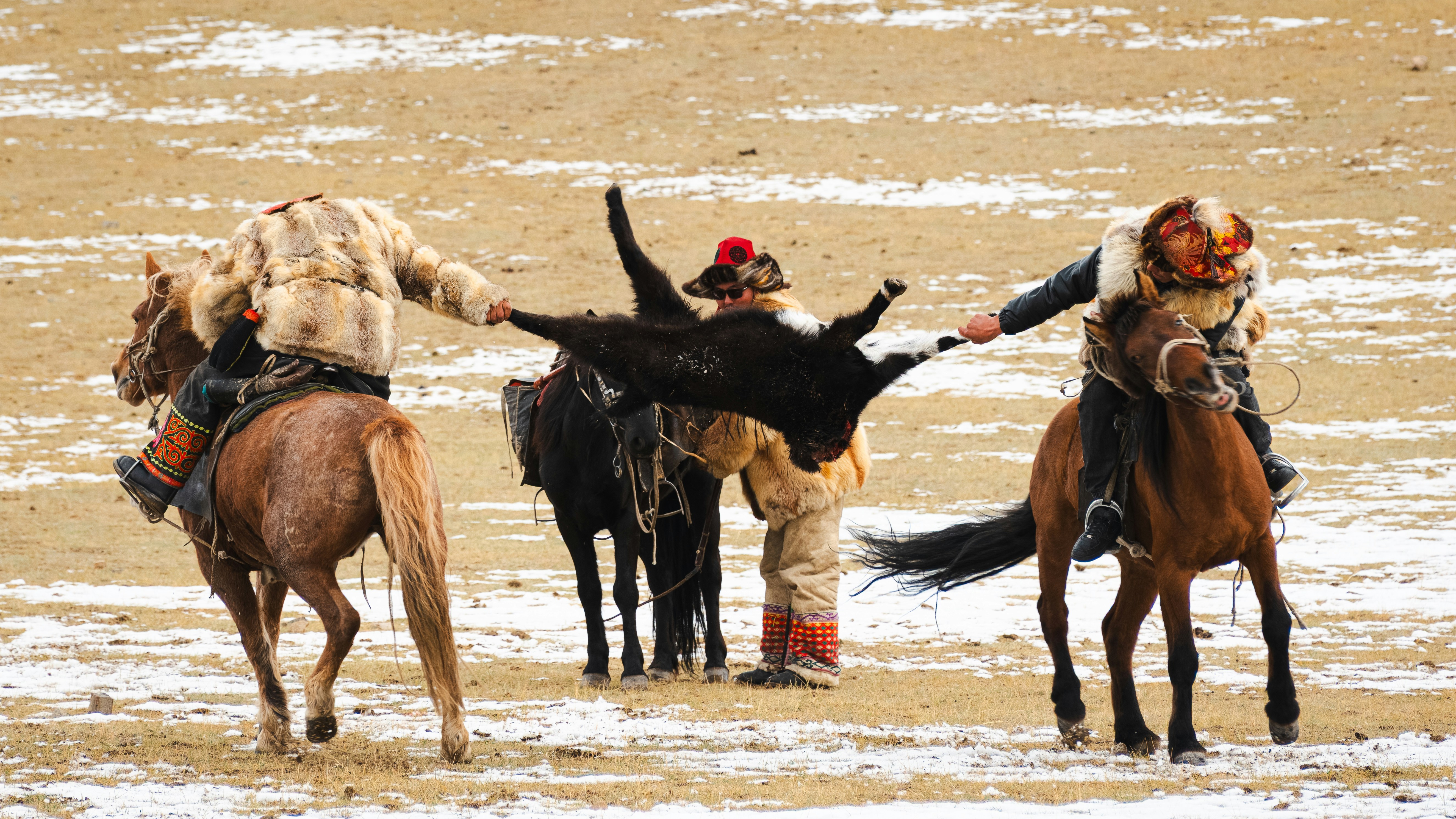 Horseback riders compete in a traditional game.