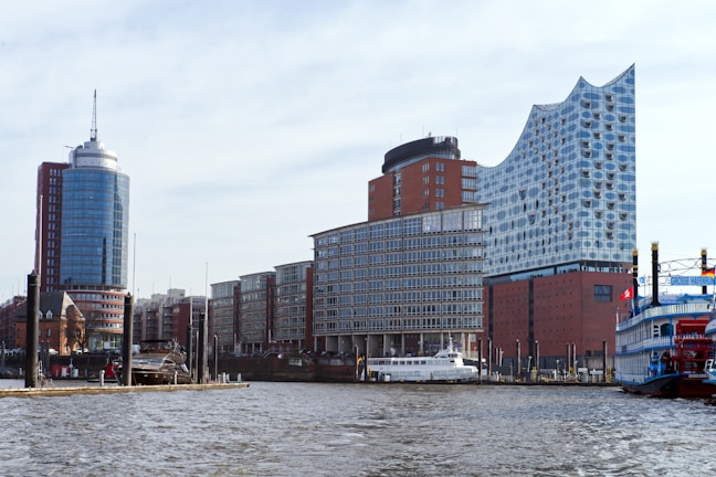 Modern buildings stand beside a waterway.