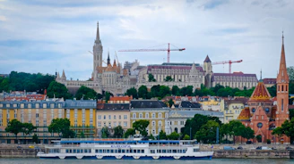 Beautiful budapest's cityscape with buildings and boats.