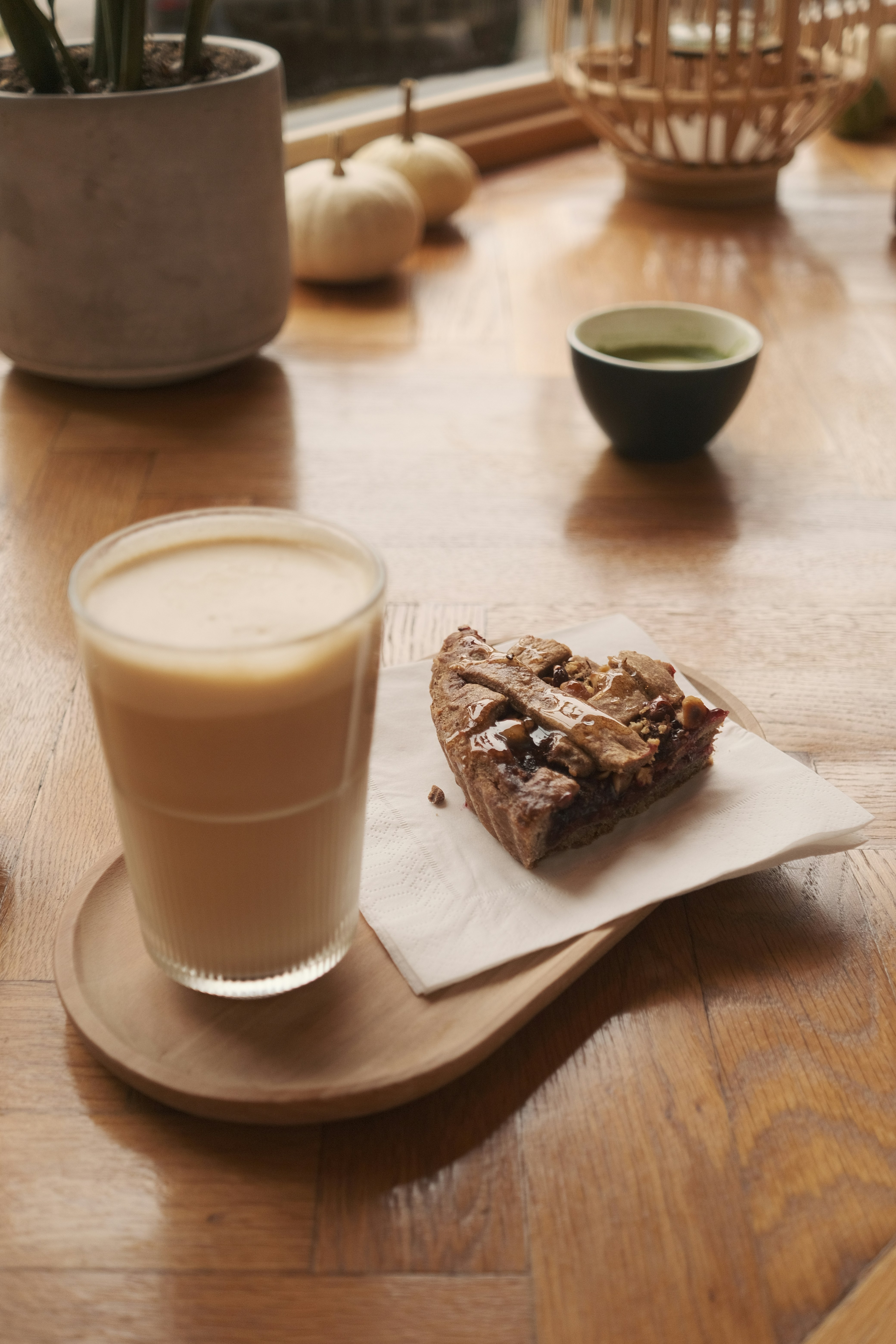 Coffee, dessert and tea on a wooden table.