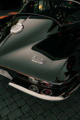 A black corvette's rear is shown in detail.