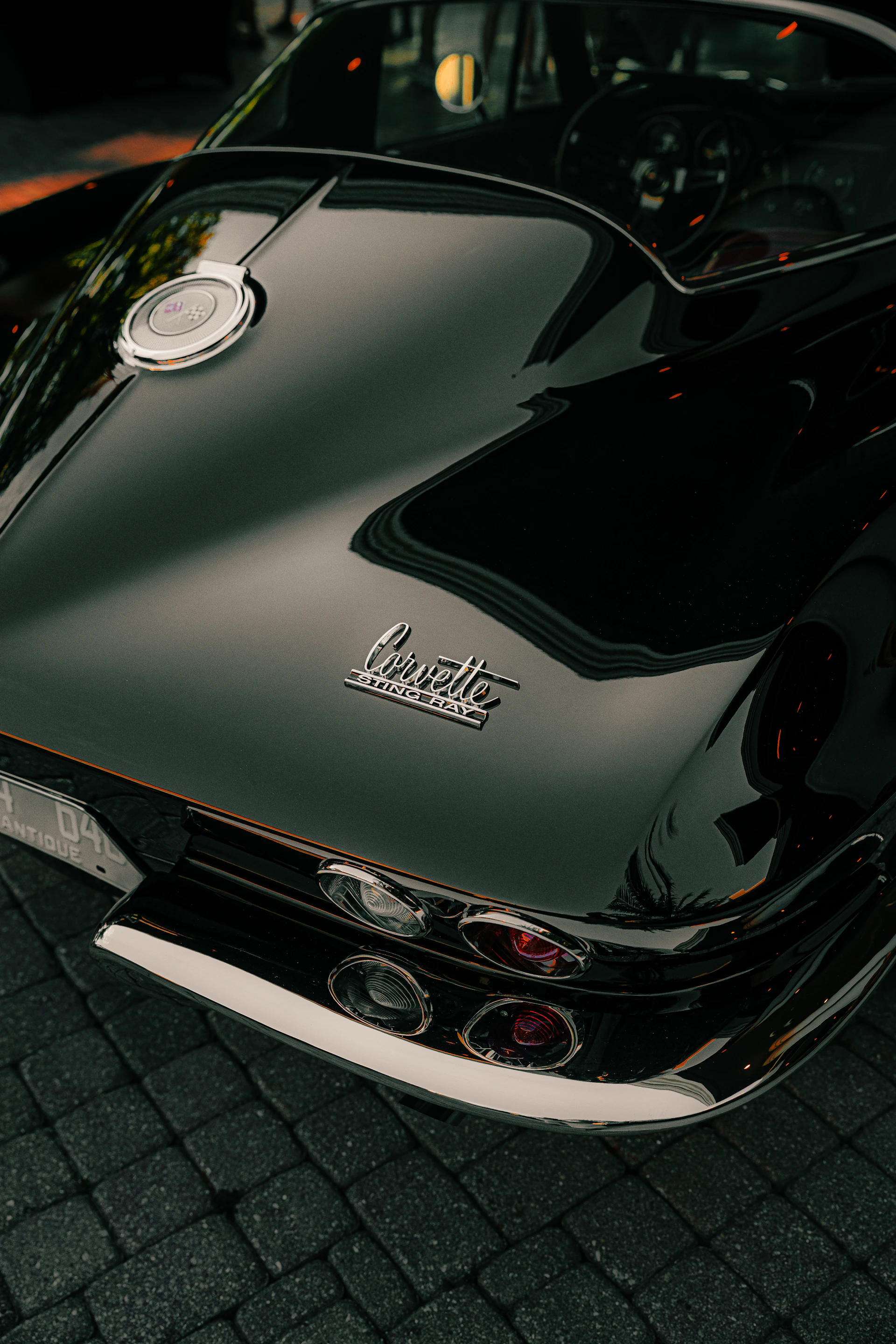 A black corvette's rear is shown in detail.