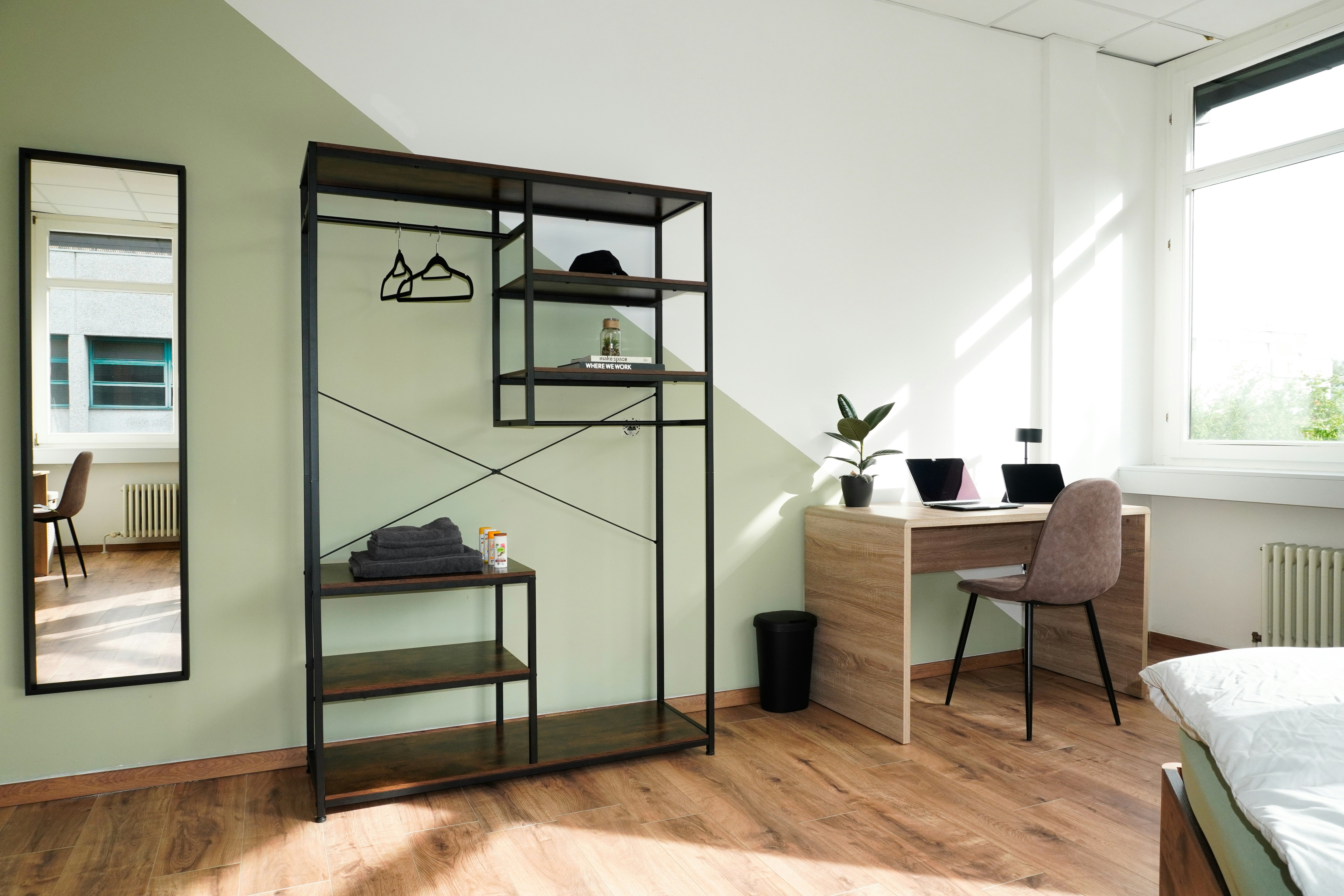 A modern bedroom with minimalist furniture is shown.