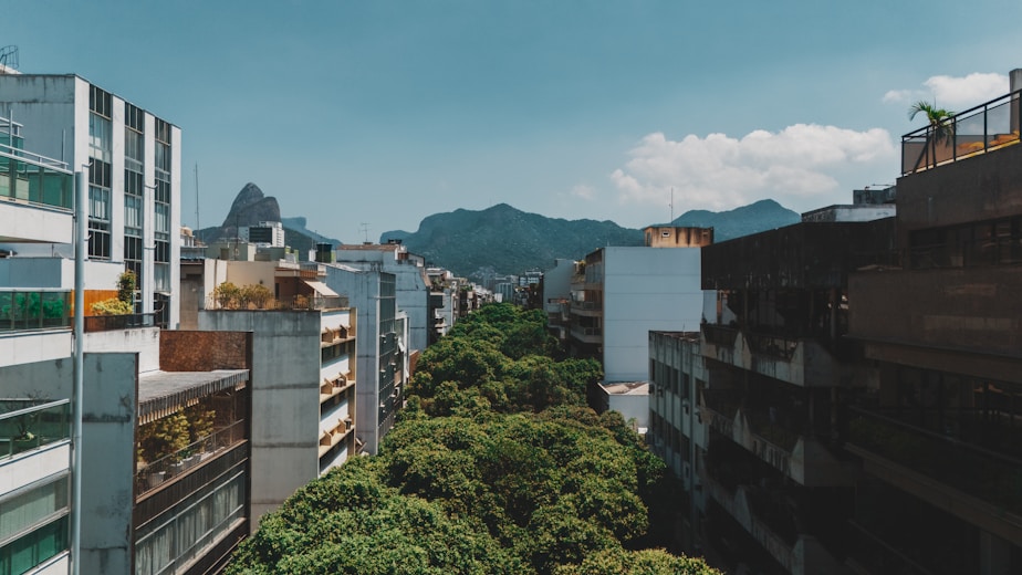 City street with mountains in the background.