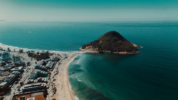 Beautiful beach with an island and city.