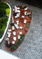 Outdoor seating area with plants and a fountain.