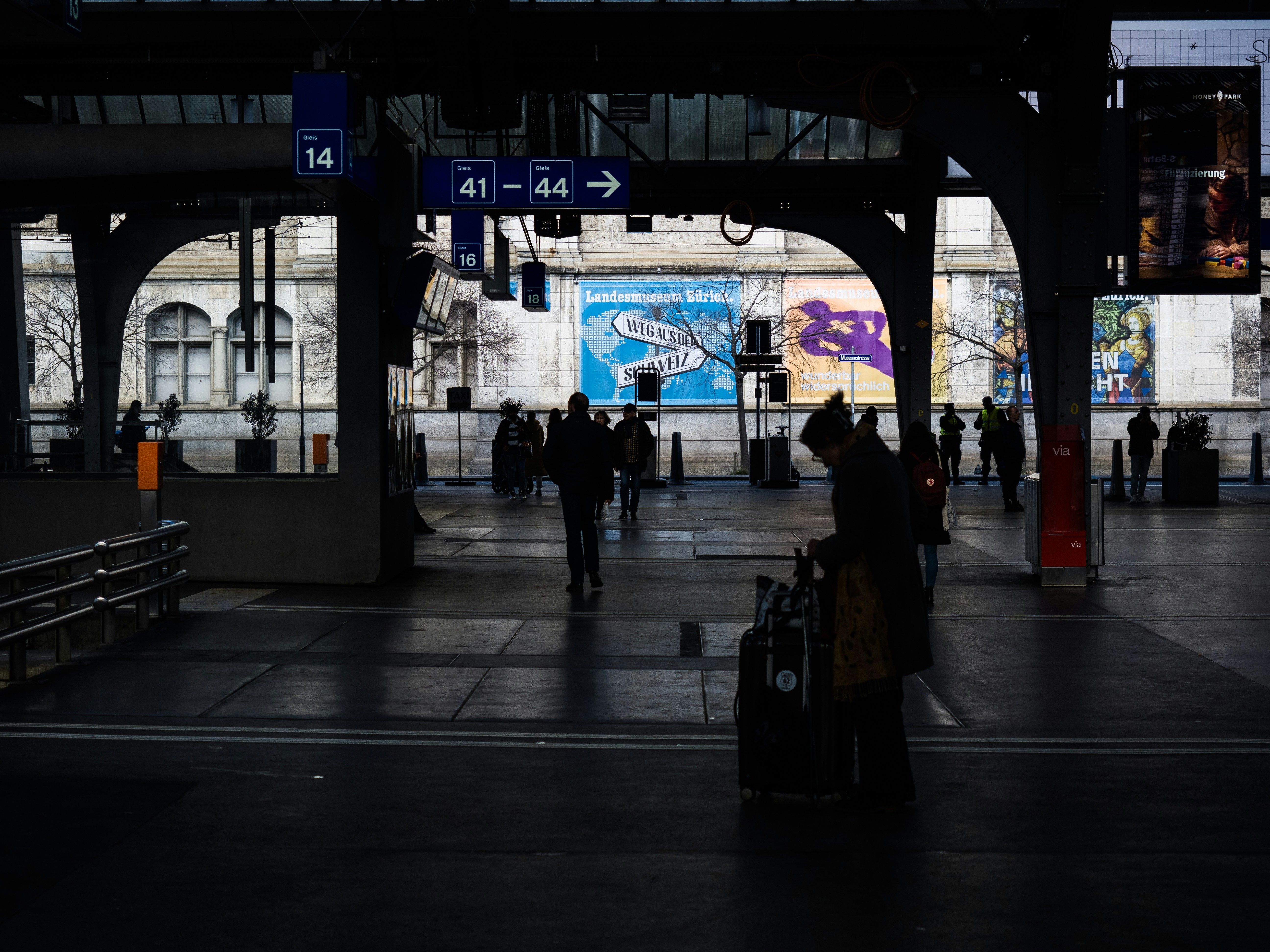 People are at a train station.