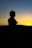 Silhouette of a person at sunset.