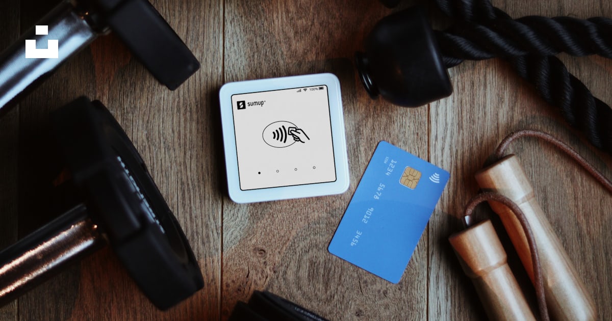 Fitness equipment beside a credit card reader and card. photo – Free ...