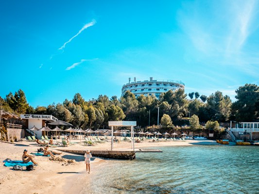 Beach resort scene on a bright, sunny day — Ksamil, Albania
