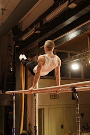 Gymnast performs a routine on the parallel bars.