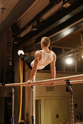 Gymnast performs a routine on the parallel bars.