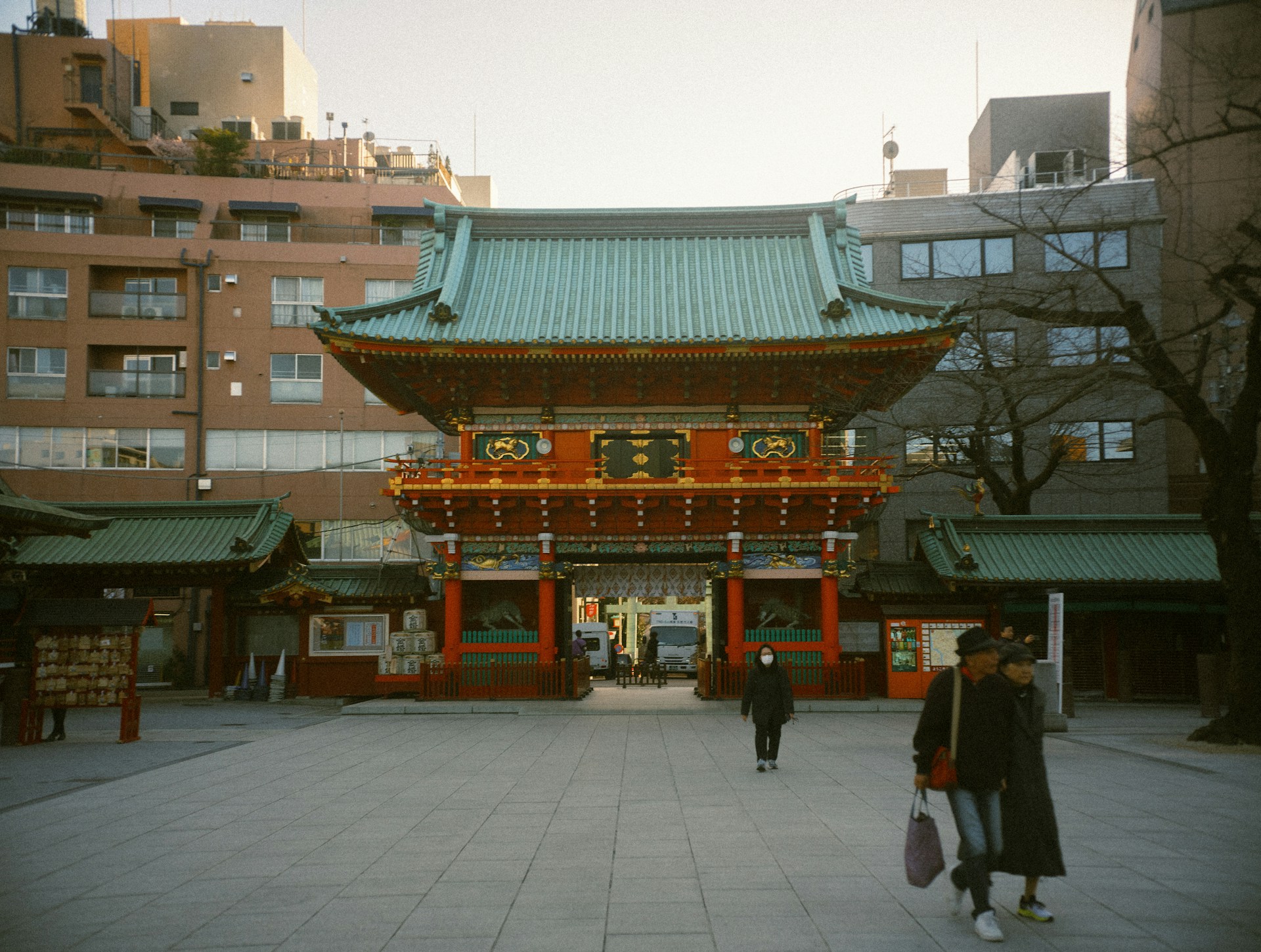 A traditional japanese temple gate in a city.