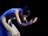 A dancer performs with graceful, open hands.