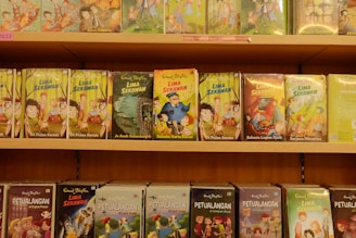 Books are neatly displayed on a bookshelf.