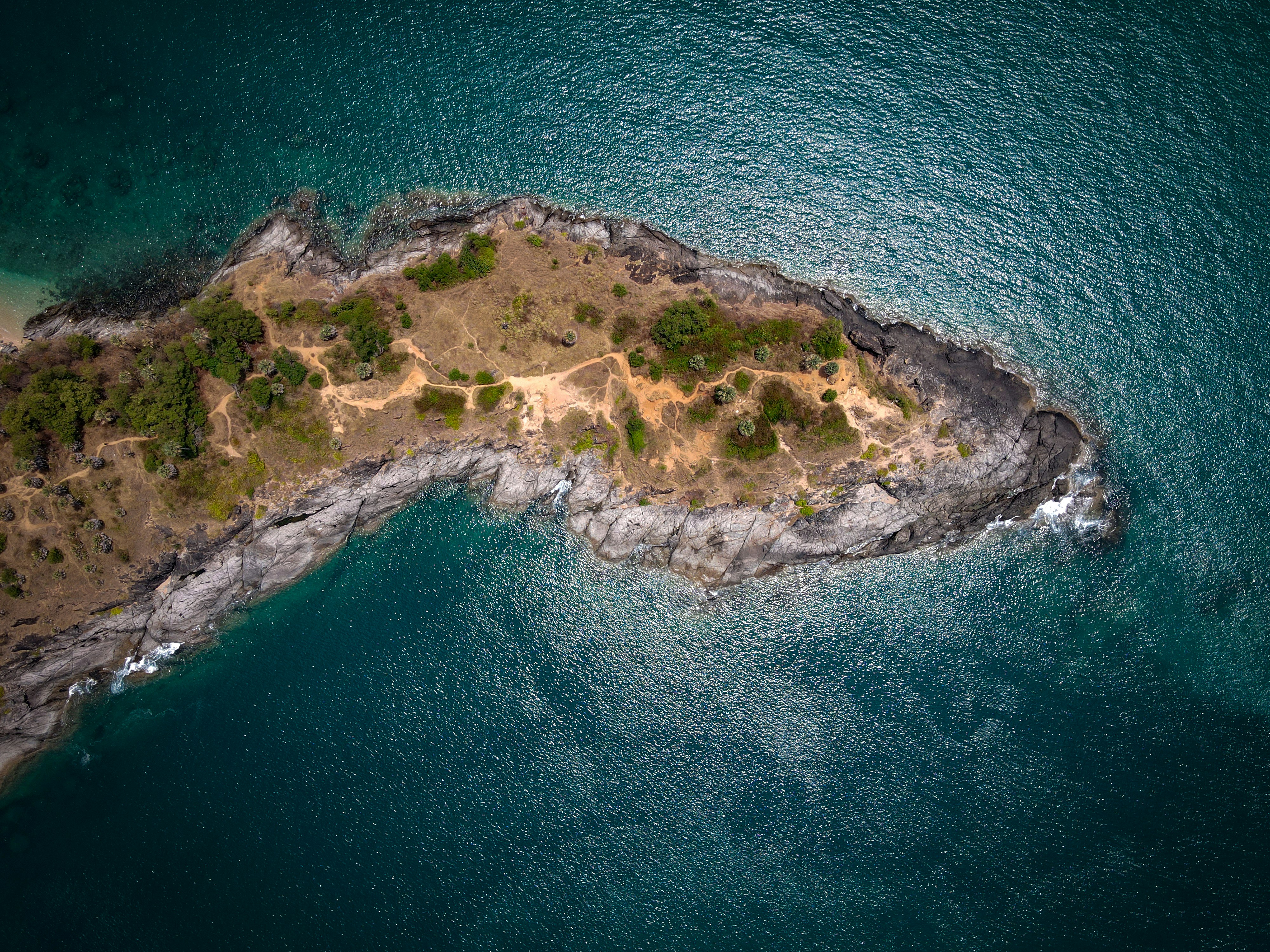 An aerial view of a small, rocky island.