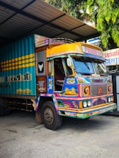 Brightly painted truck parked in a garage.