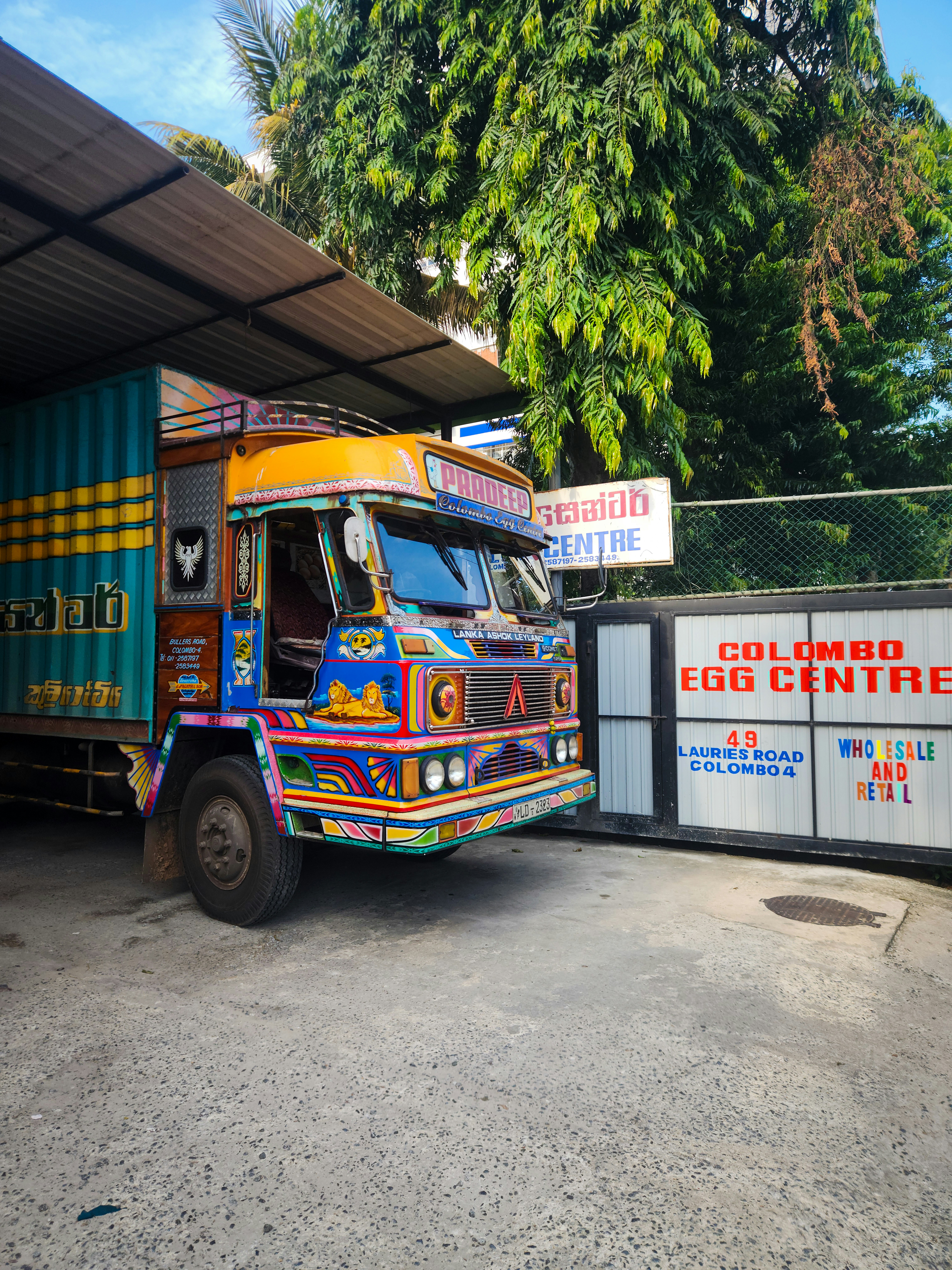 A colorful truck parked at the egg center.