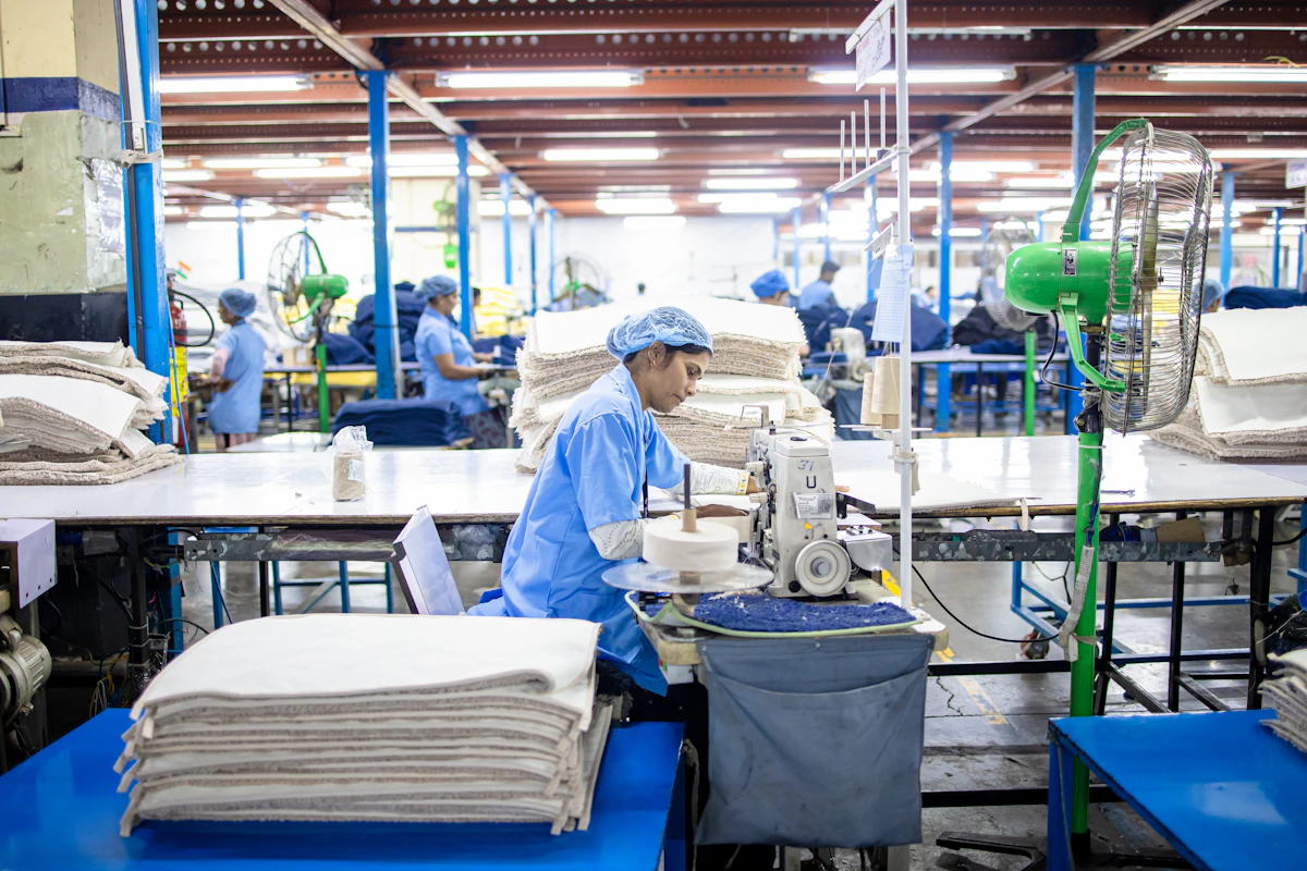 Workers sewing fabric in a textile factory