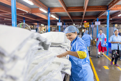 Workers are in a textile factory.