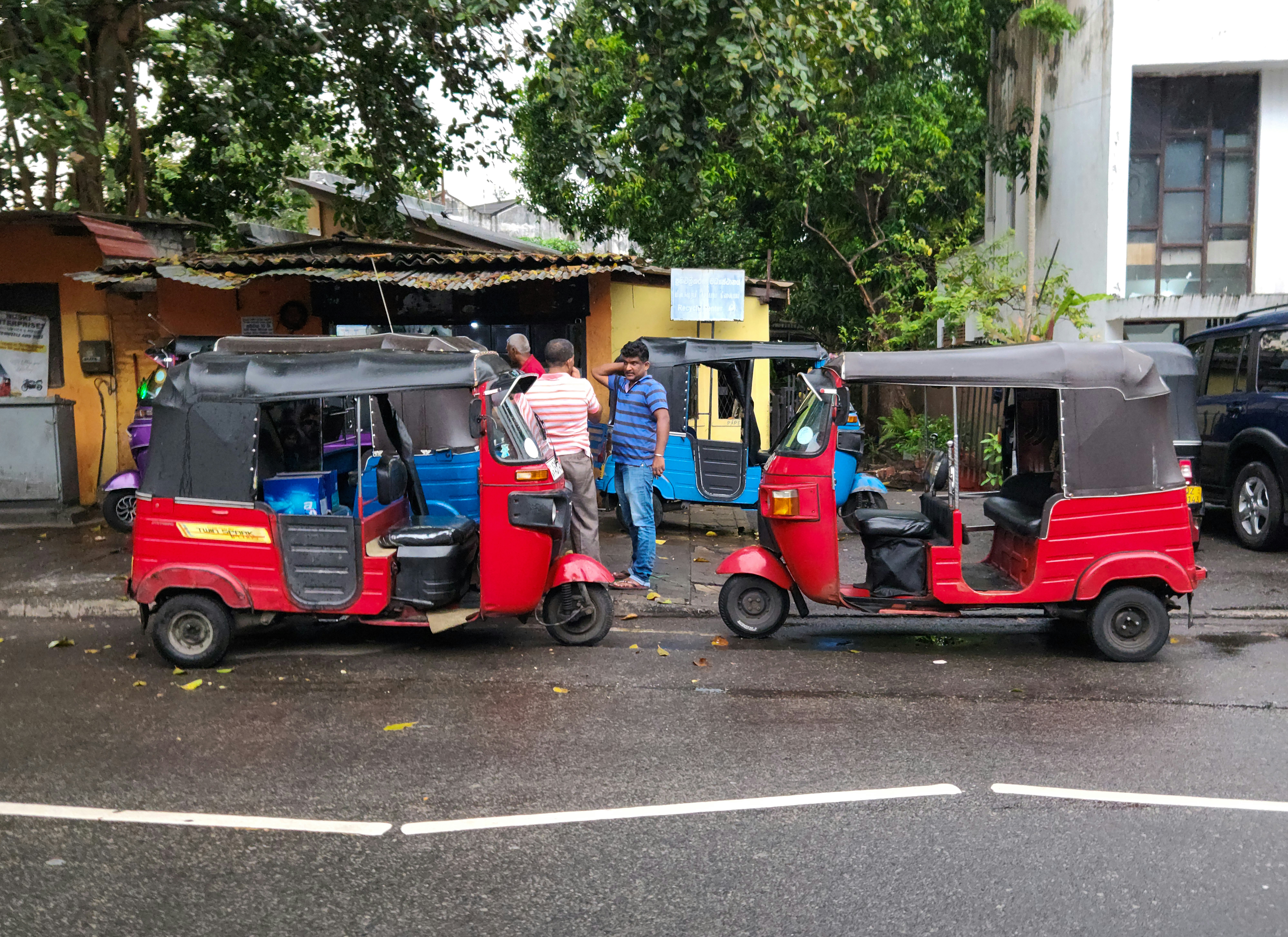 Some Tuktuks parked on the street in Colombo