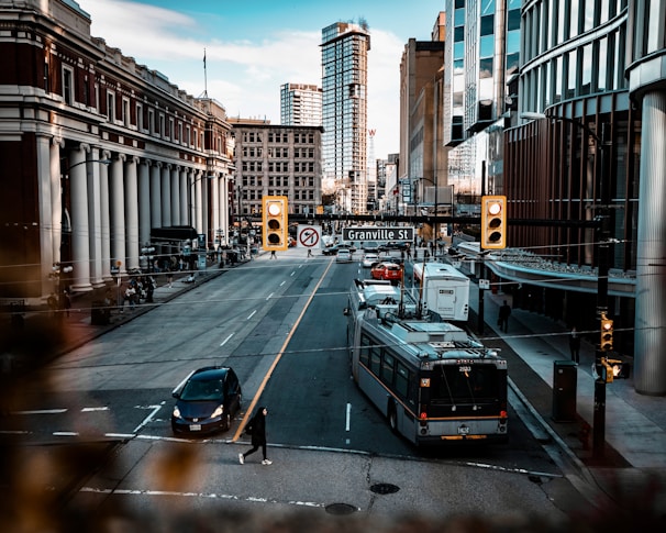 A busy city street with buildings and traffic.
