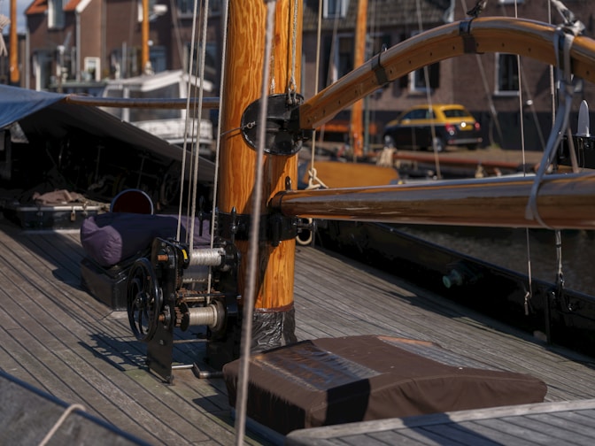 A wooden boat deck with rigging details.