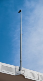 Street lamp against a blue sky.